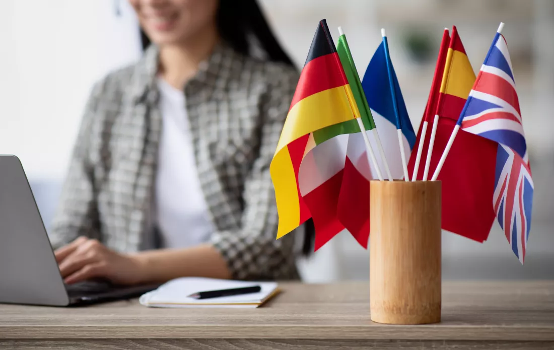 cropped-asian-woman-foreign-language-teacher-using-laptop
