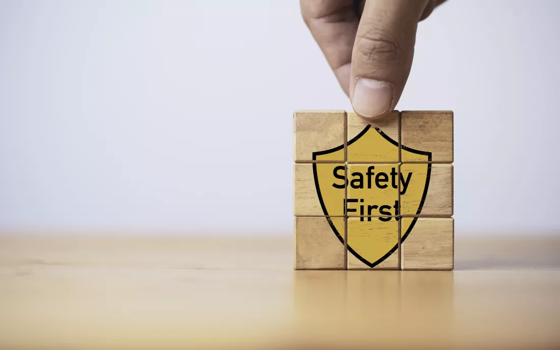 hand-assemble-safety-first-icon-wooden-block-cube-worker-caution-work-hazards-work-place-by-zero-accident-concept