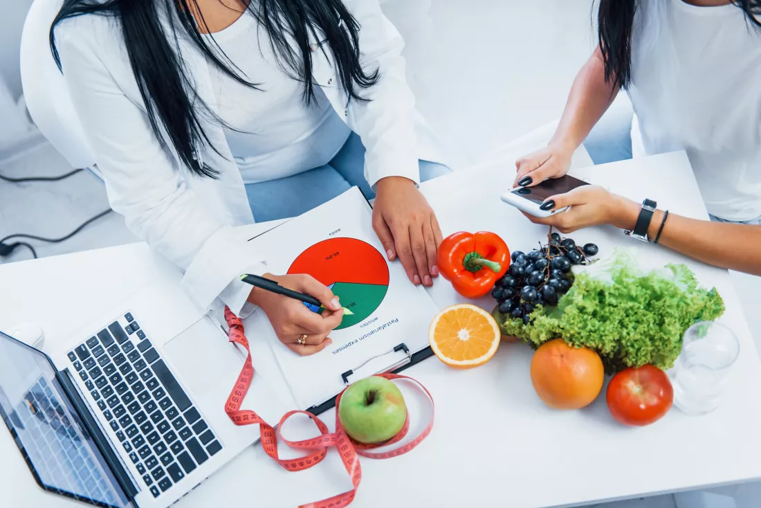 top-view-female-nutritionist-that-gives-consultation-patient-indoors-office